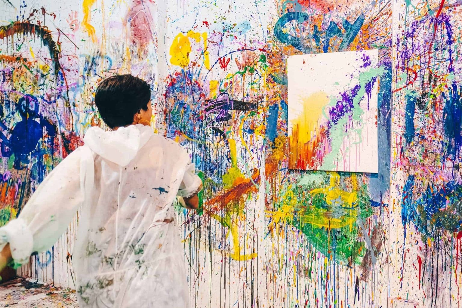 Art jamming workshop with participants painting canvases